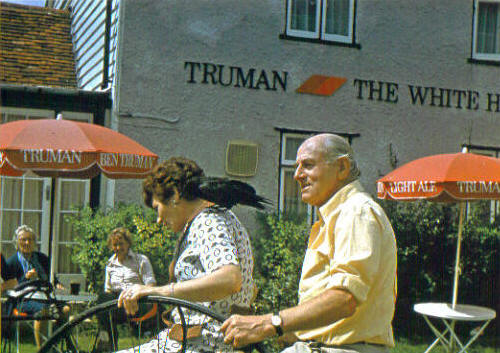 The late Cliff Eveleigh , former renowned landlord of The White Hart at Margaretting Tye with wife and crow.