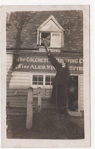 Frederick Kempster, the worlds tallest man at 8ft 4.5", outside the Kings Head, Landermere, Essex. He died at the age of 30 in 1918