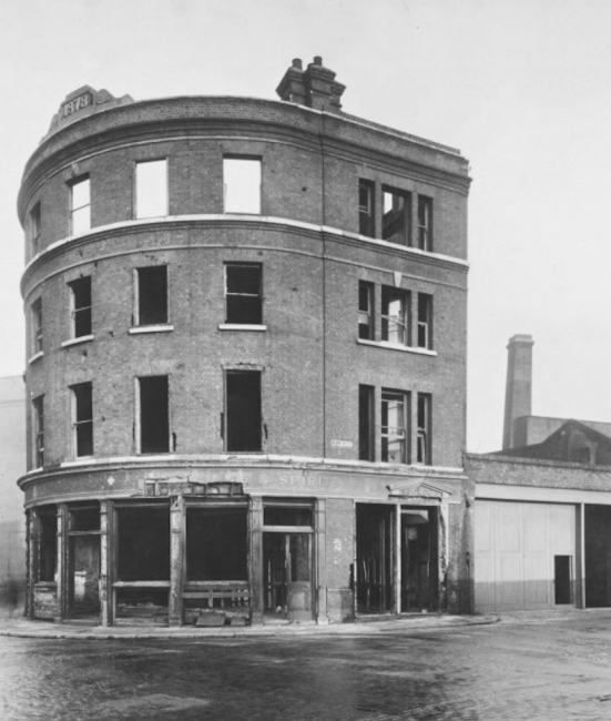 The burnt out Albion Tavern, St Katherines Way at the corner of Burr Street - dated 21st January 1943, the building is dated 1878