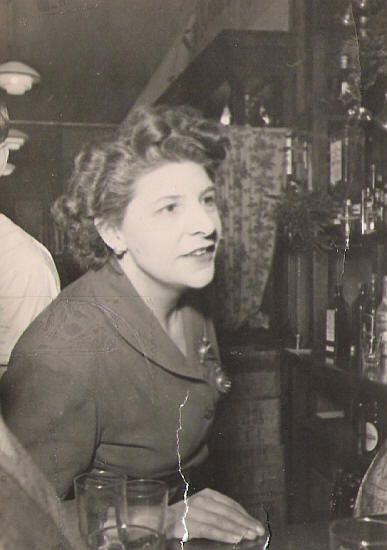 Mrs Alice Clarke serving behind the bar of The Lamb - circa 1945