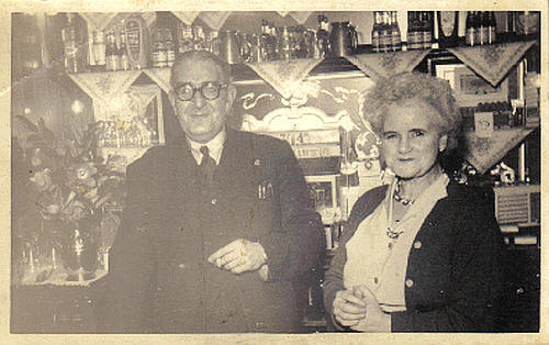 Frank & Jessie Quinn behind the bar of the Nags Head, Bow Common Lane