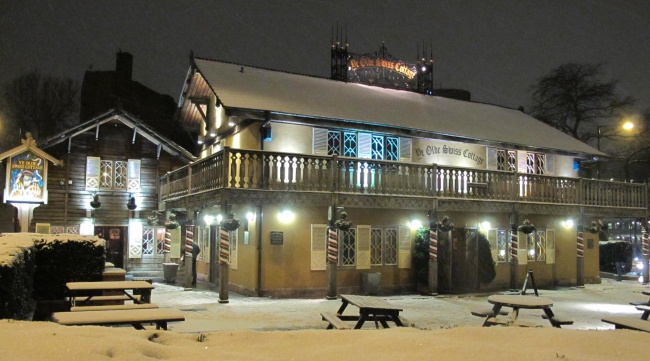 Ye Olde Swiss Cottage at the junction of Finchley Road and Avenue Road, from 2013 and shows the present building.