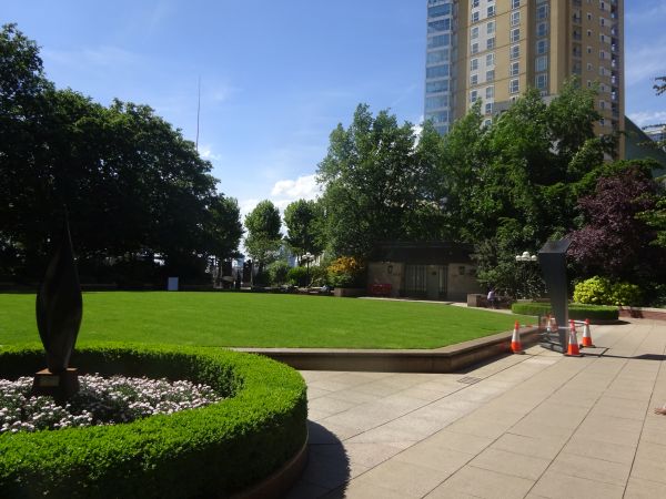 Westferry circus, leading to West India avenue and Canary wharf, with public toilets and seating.
